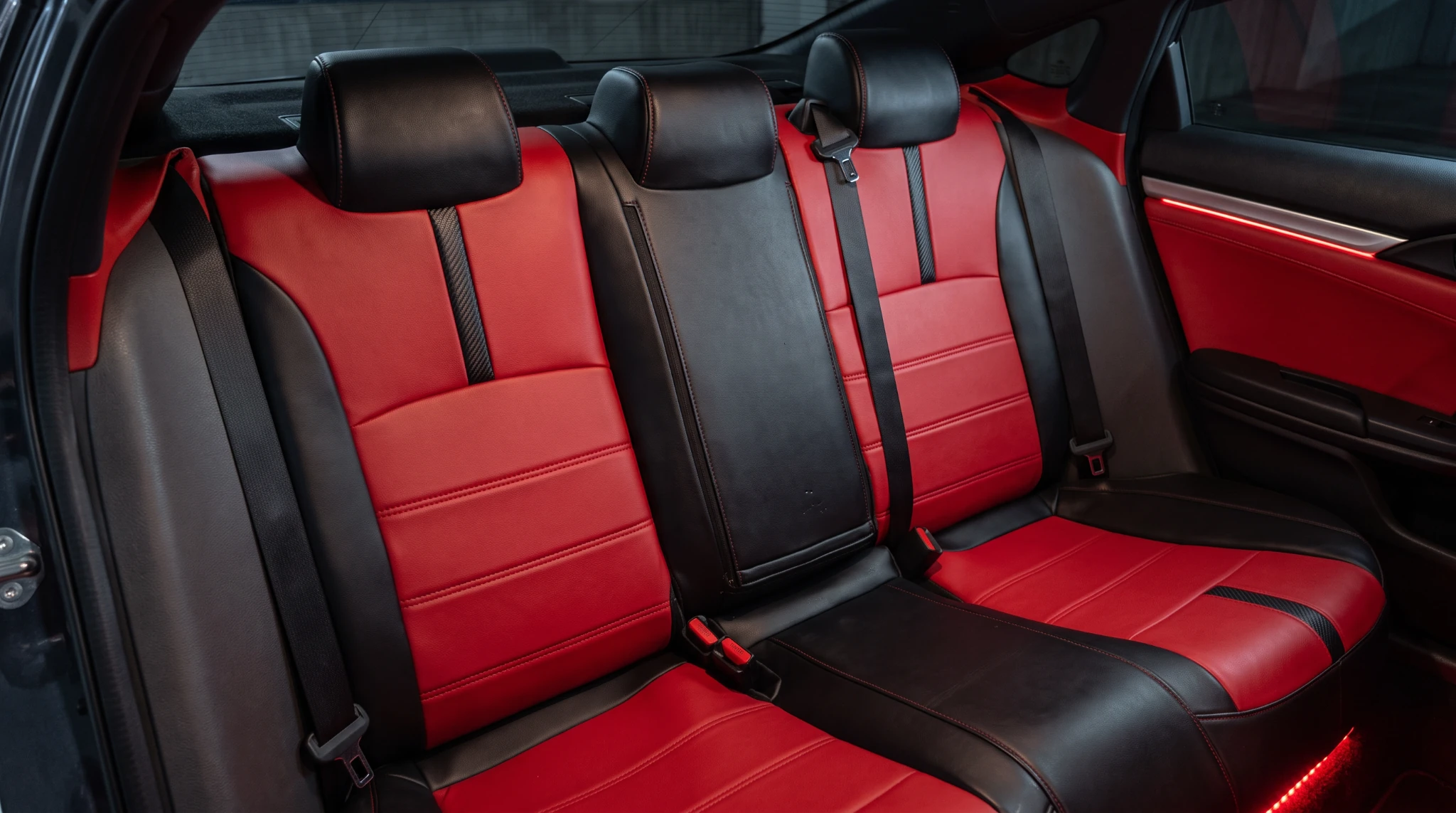 Red and black rear seats, seams and rear cabin after detailing